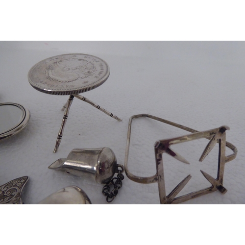 2 - Silver and white metal collectables: to include a whistle  indistinct marks