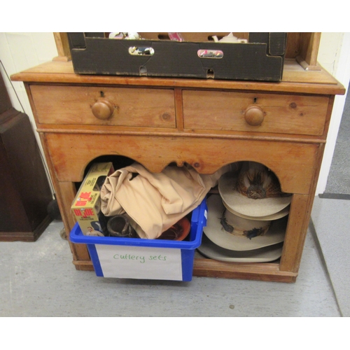 205 - A Victorian and later pine dresser with two open shelves, over two drawers and an open section below... 