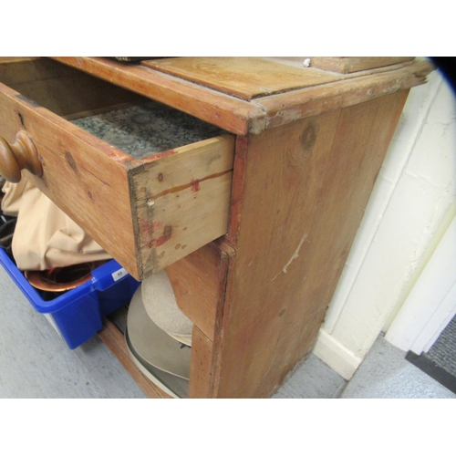 205 - A Victorian and later pine dresser with two open shelves, over two drawers and an open section below... 