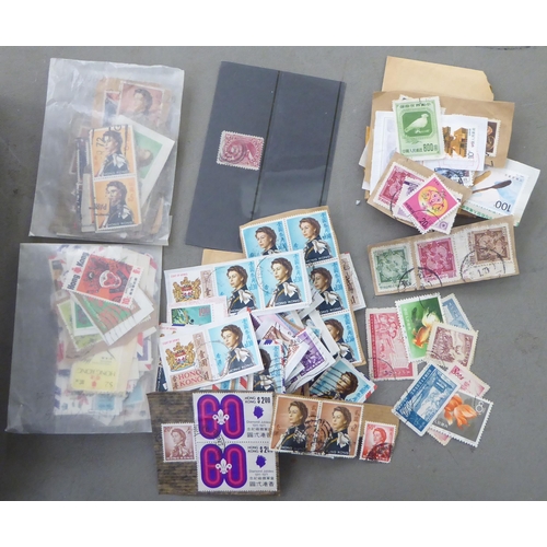 209 - A miscellaneous collection of uncollated postage stamps: to include Chinese issues  