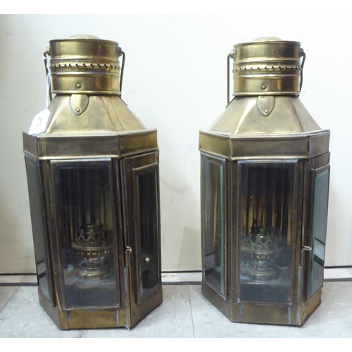 213 - A pair of modern reproductions of brass cased bulkhead lanterns with glazed windows  17