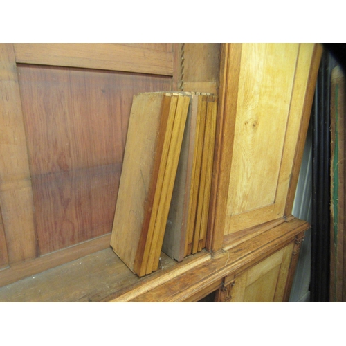 217 - A mid Victorian oak library bookcase, comprising a central section of seven open shelves, flanked by... 