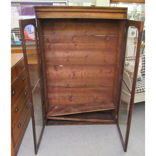 222 - A late Victorian mahogany bookcase, enclosed by two full height astragal glazed doors  70