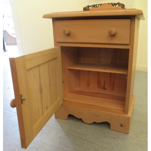 229 - A modern pine bedside cabinet with a drawer and a door, on a plinth  24