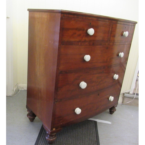 235 - An early 19thC mahogany bow front dressing chest with two short/three long drawers, raised on turned... 