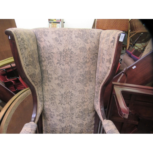 237 - An Edwardian mahogany framed porter style chair, upholstered in a flora fabric, raised on cabriole l... 