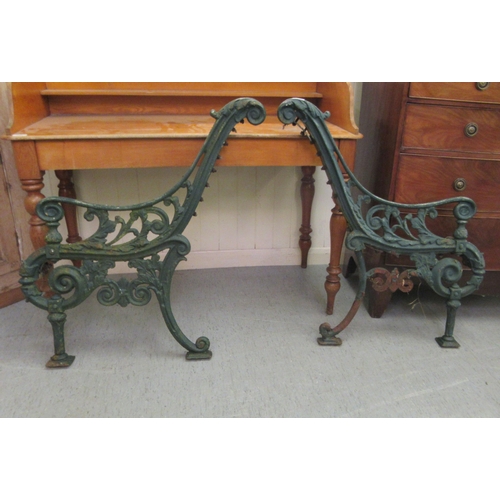 238 - A pair of late Victorian blue painted cast iron bench ends 