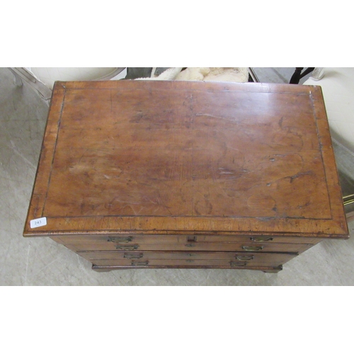 243 - A late 18thC style walnut veneered dressing chest with crossbanded and string inlaid ornament, compr... 