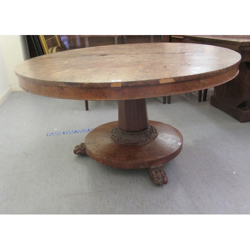 244 - A 19thC walnut tip-top table, the segmented, figured top over a tapered octagonal, bulbous pedestal,... 