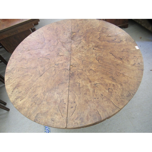 244 - A 19thC walnut tip-top table, the segmented, figured top over a tapered octagonal, bulbous pedestal,... 