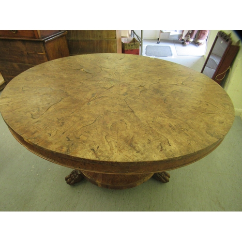 244 - A 19thC walnut tip-top table, the segmented, figured top over a tapered octagonal, bulbous pedestal,... 