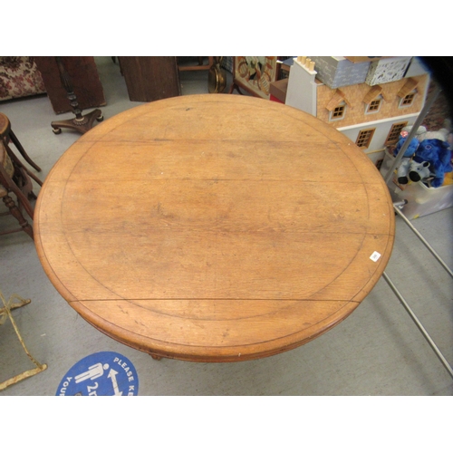 249 - A late 19thC oak tip-top table, over an octagonal bulbous pedestal, raised on a cabriole tripod base... 