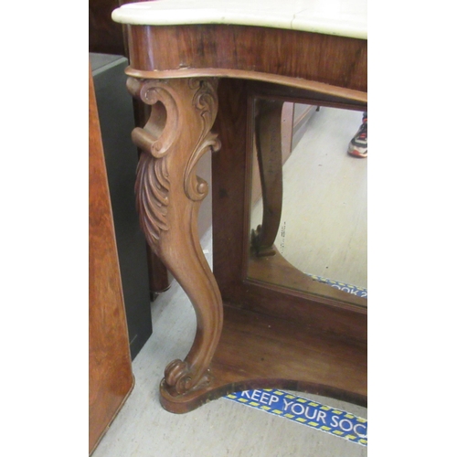 257 - A late Victorian walnut framed serpentine front serving table, the top set with a marble panel, rais... 