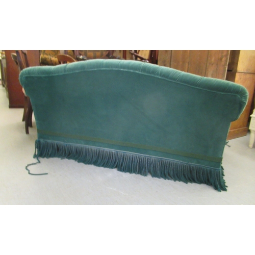 265 - A modern Chesterfield style two person settee, button upholstered in green dralon with a tasselled f... 