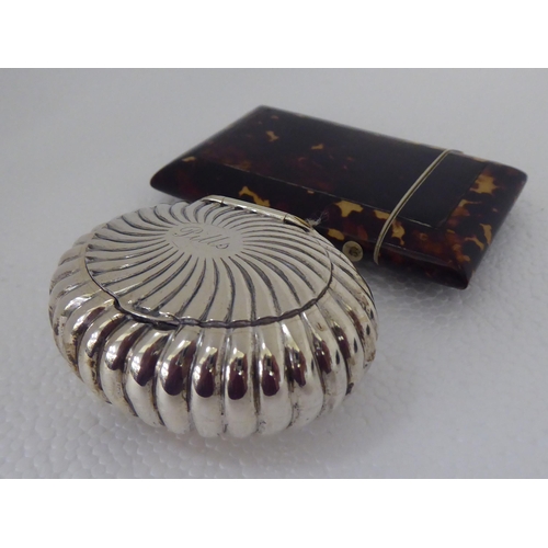 272 - A silver oval reed moulded pill box with a hinged lid  London 1894; two dissimilar snuff boxes;... 