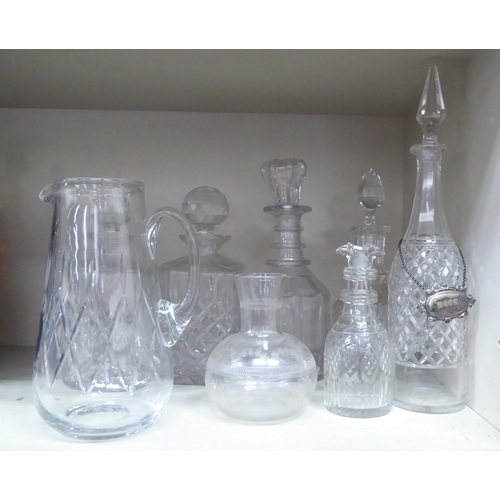 273 - Decorative glassware: to include a pair of cut crystal, shouldered, square whisky decanters