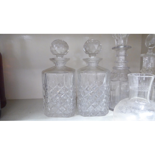 273 - Decorative glassware: to include a pair of cut crystal, shouldered, square whisky decanters