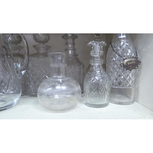 273 - Decorative glassware: to include a pair of cut crystal, shouldered, square whisky decanters