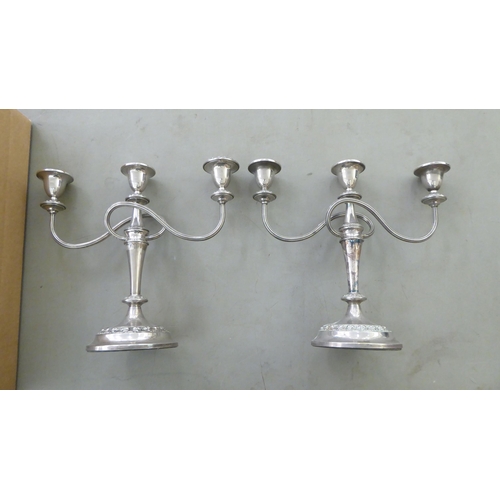 277 - Silver plated and similar flatware; and a pair of twin branch table candlesticks  14