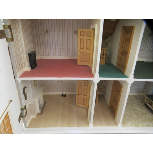 293 - A modern dolls house with hinged doors, on a plinth  32