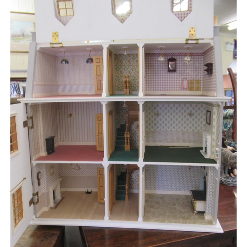 293 - A modern dolls house with hinged doors, on a plinth  32