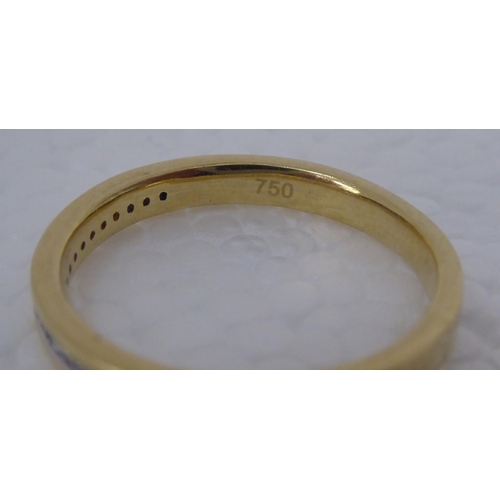 297 - A gold coloured metal, rubover set diamond half eternity ring  stamped 750 