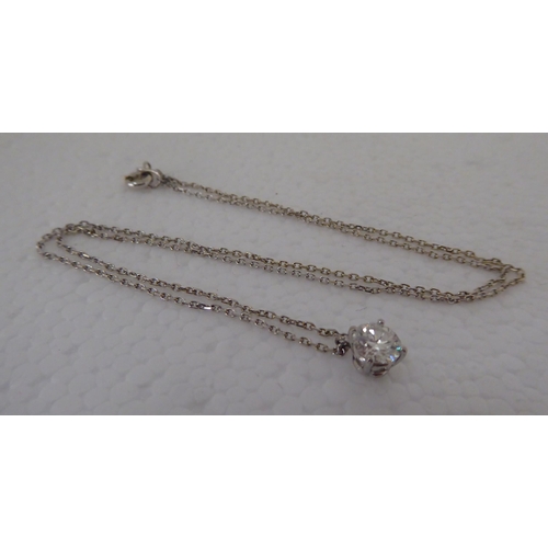 298 - A silver coloured metal claw set single stone diamond pendant, on a fine neckchain and ring bolt cla... 