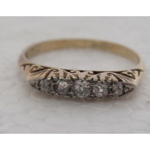 309 - An 18ct gold ring, set with five diamonds 