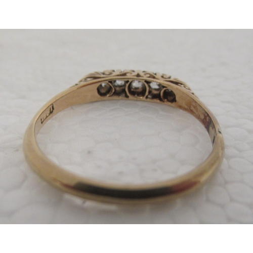 309 - An 18ct gold ring, set with five diamonds 