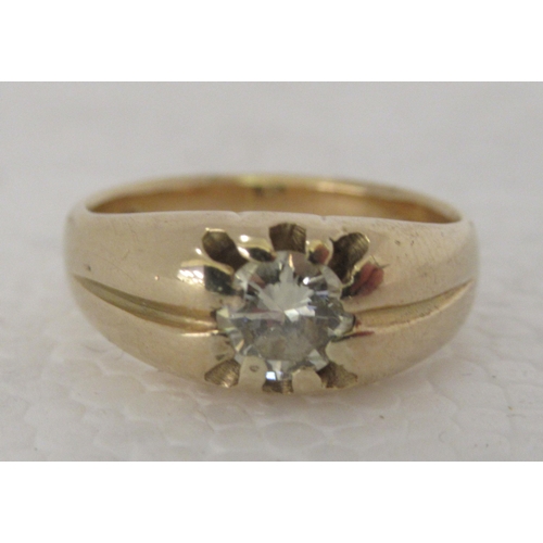 310 - An 18ct gold gypsy ring, set with a single central diamond 