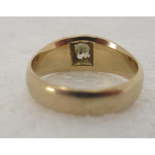 310 - An 18ct gold gypsy ring, set with a single central diamond 