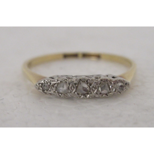 315 - An 18ct gold ring, set with five diamonds 