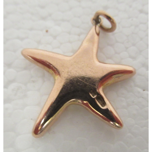 320 - A 9ct gold pendant, fashioned as a starfish, set with a central diamond 