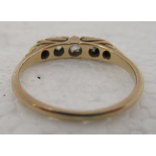 323 - An 18ct gold ring, set with five diamonds