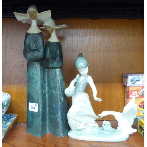 354 - Ceramics: to include a Lladro porcelain model, a girl and swan  8.5