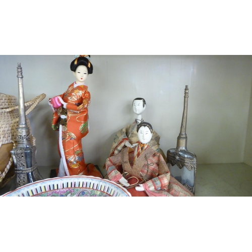 380 - 20thC Asian collectables: to include hardwood stands; and dolls  largest 11