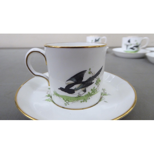 6 - A set of six Royal Crown Derby china Cuthbert Gresley coffee cans and saucers, painted with magpies