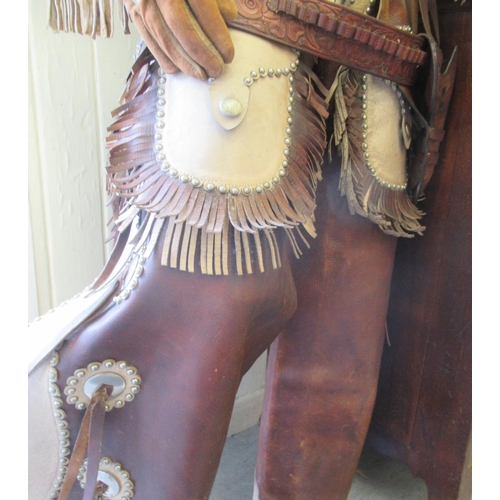 66 - A male life-size mannequin, dressed as a cowboy  78