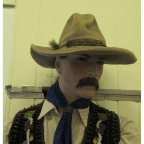 66 - A male life-size mannequin, dressed as a cowboy  78