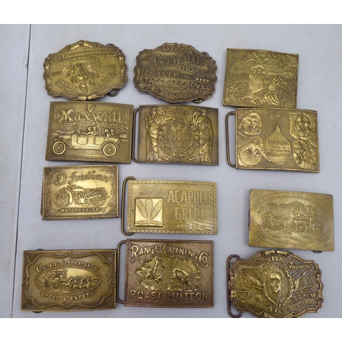 72 - A collection of variously themed reproductions American cast metal plates; and belt buckles