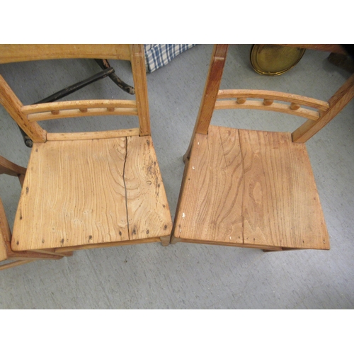 135 - Four early 19thC country made ash and oak framed dining chairs with solid seats, raised on square le... 