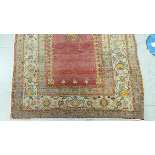 218 - A Persian rug, decorated in colours and traditional designs  75