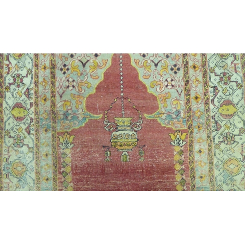 218 - A Persian rug, decorated in colours and traditional designs  75