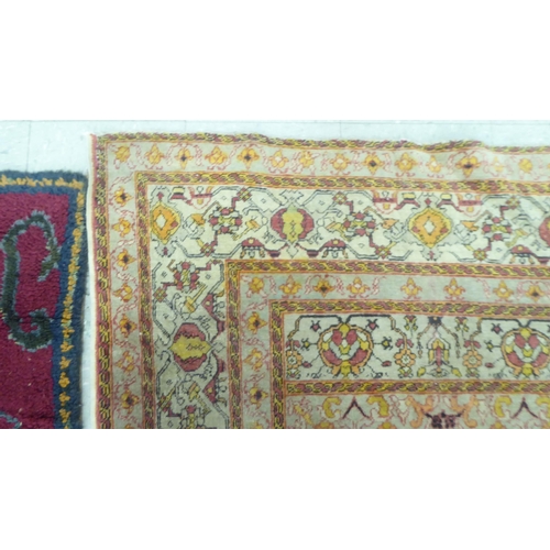 218 - A Persian rug, decorated in colours and traditional designs  75