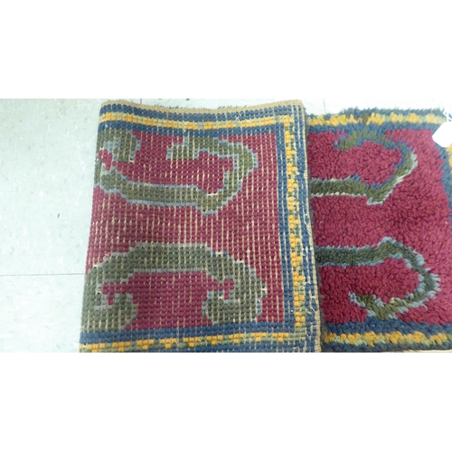 218 - A Persian rug, decorated in colours and traditional designs  75