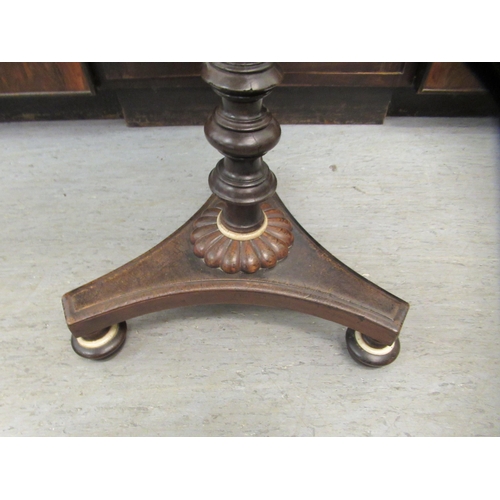 233 - A Regency mahogany pedestal table with a papier mache tray top, raised on a tripod base  28