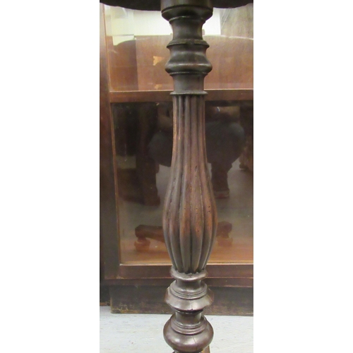 233 - A Regency mahogany pedestal table with a papier mache tray top, raised on a tripod base  28