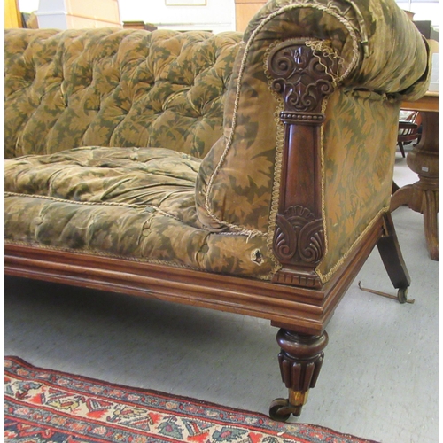 242 - A Regency rosewood framed salon settee, button upholstered in a gold floral fabric, raised on turned... 