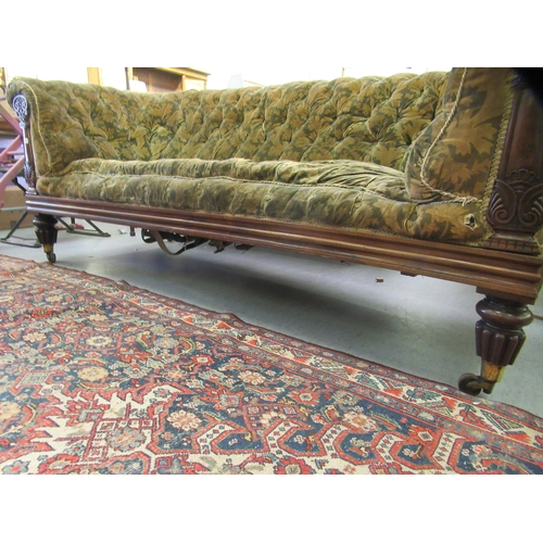 242 - A Regency rosewood framed salon settee, button upholstered in a gold floral fabric, raised on turned... 