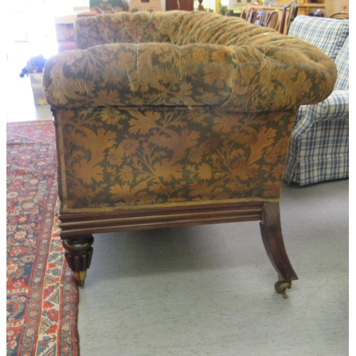 242 - A Regency rosewood framed salon settee, button upholstered in a gold floral fabric, raised on turned... 